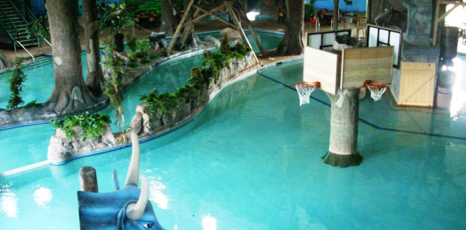 An aerial view of the indoor waterpark with basketball hoops.