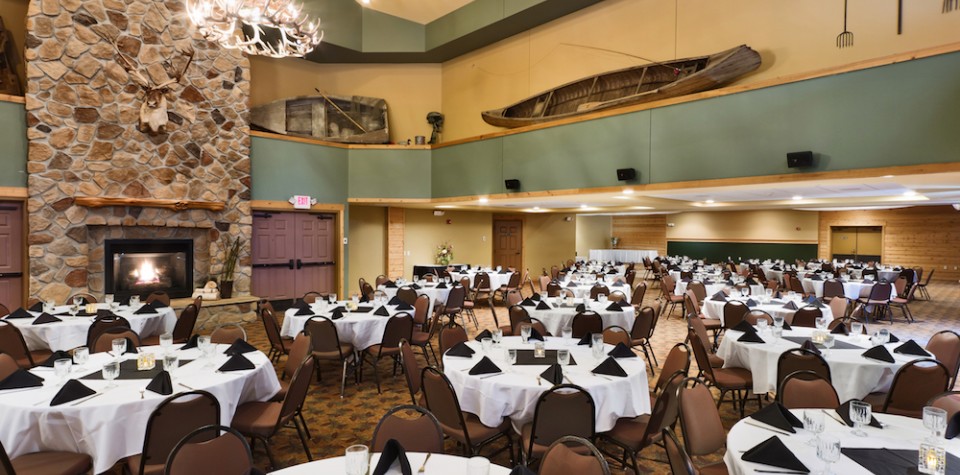 Large ballroom setup with round tables