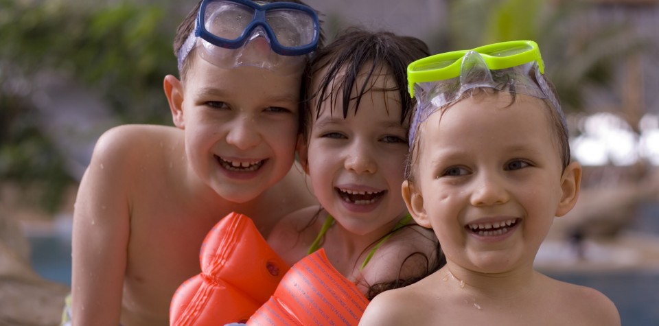Three kids playing at the waterpark